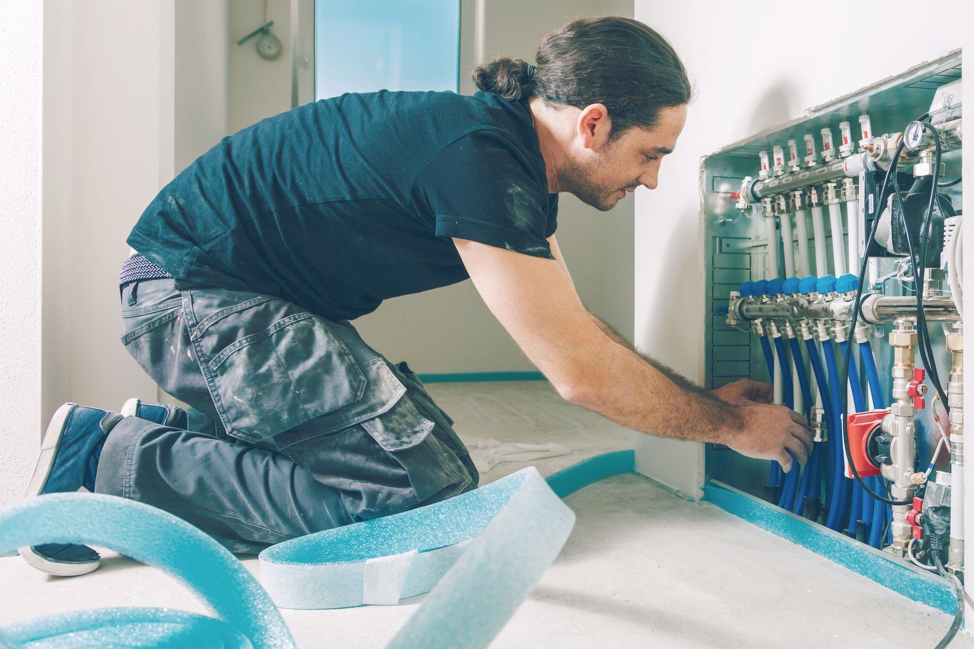 Radiant Floor Heating Installation. Repair floor heating system with insulated metal pipes. Radiant Floor Heating Installation. Repair floor heating system with insulated metal pipes.